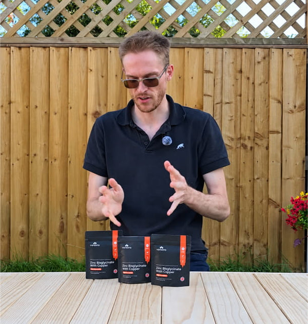 Customer at an outdoor table with three pouches of Varsons Zinc Bisglycinate with Copper